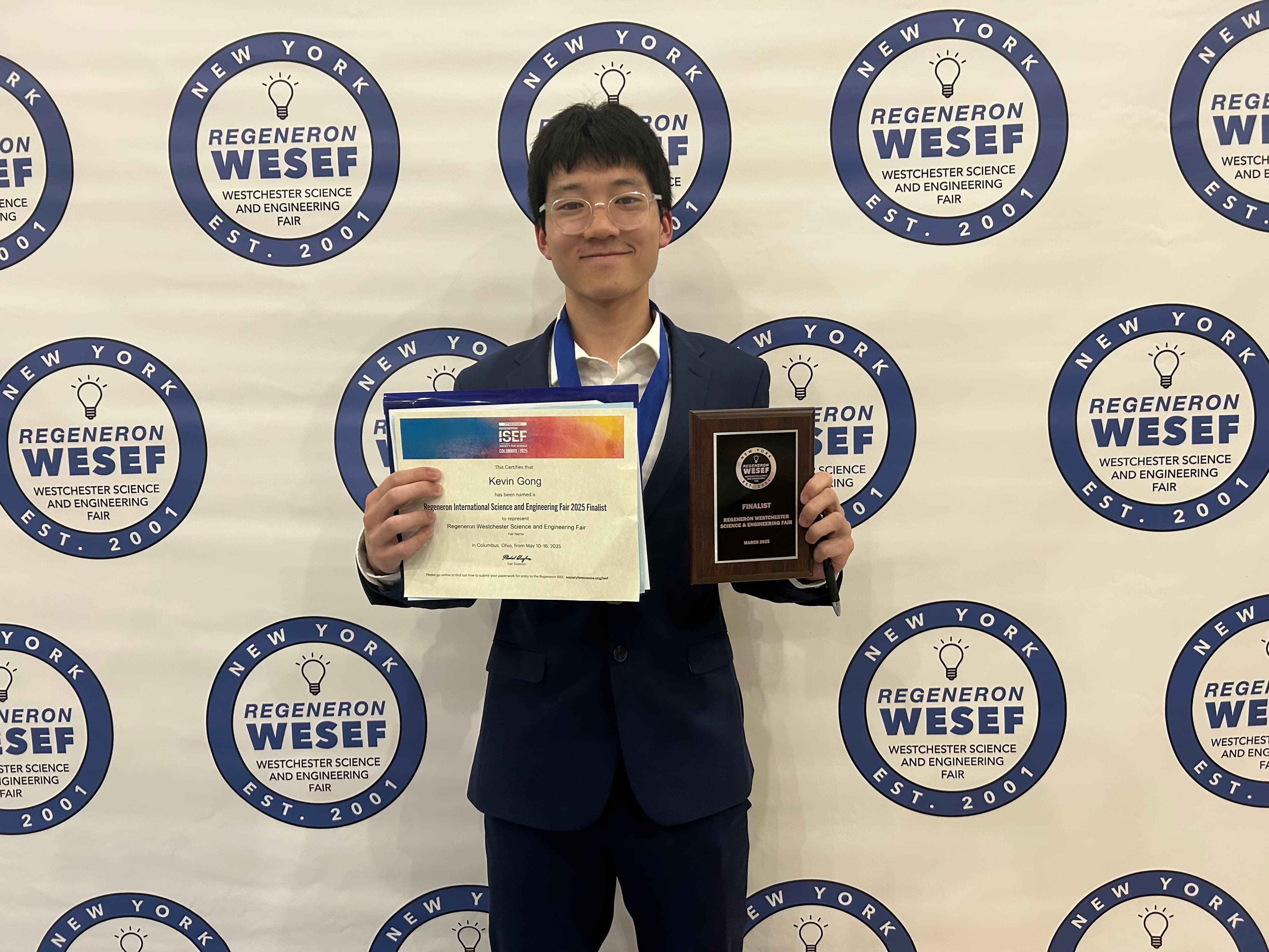 Kevin Gong holding an award