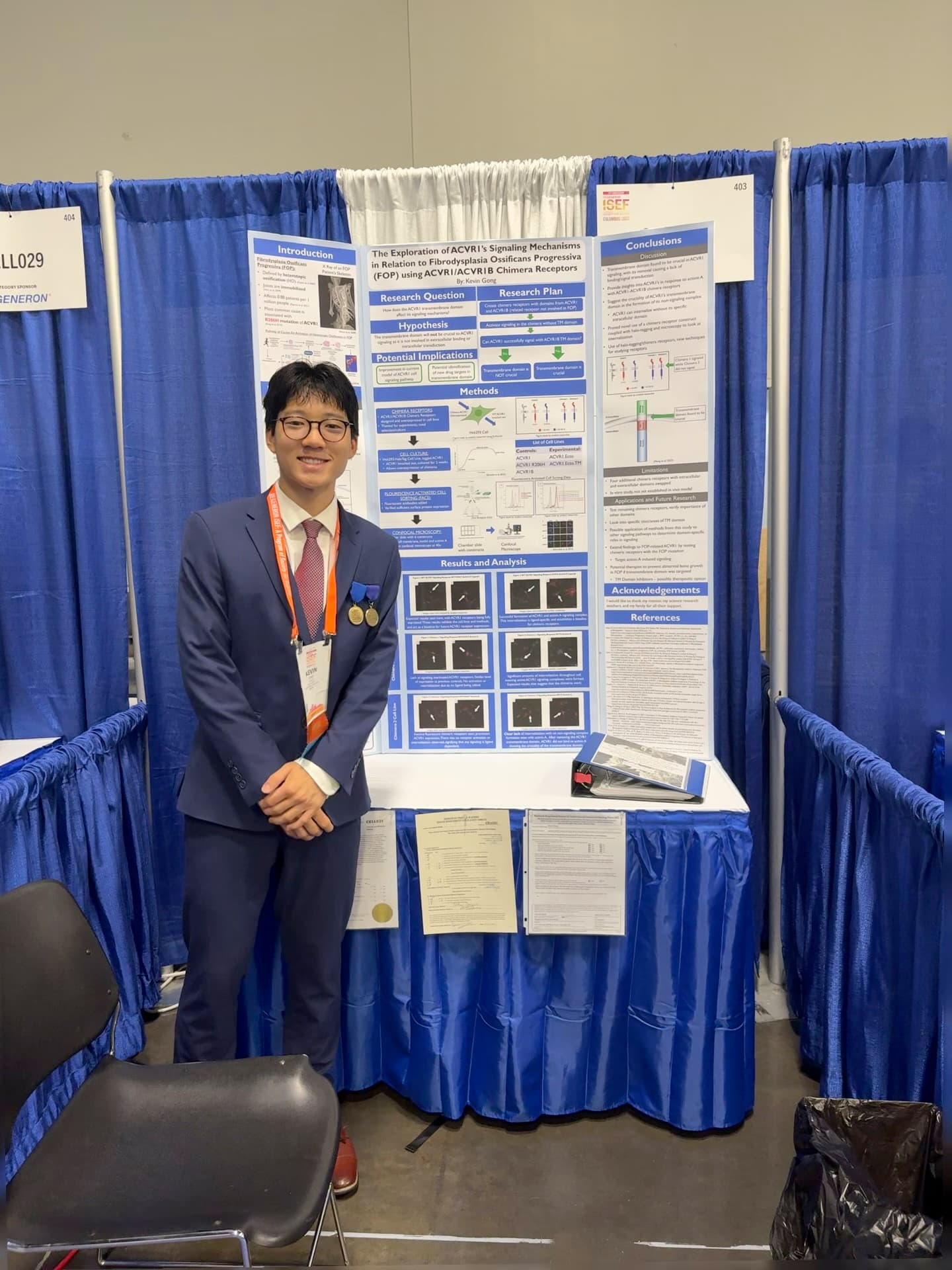 Kevin Gong presenting research at a science fair booth